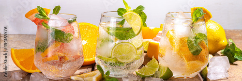 Summer healthy cocktails, mocktails. Set of various citrus lemonades mojito, with lime, lemon, orange, grapefruit, diet detox beverages photo