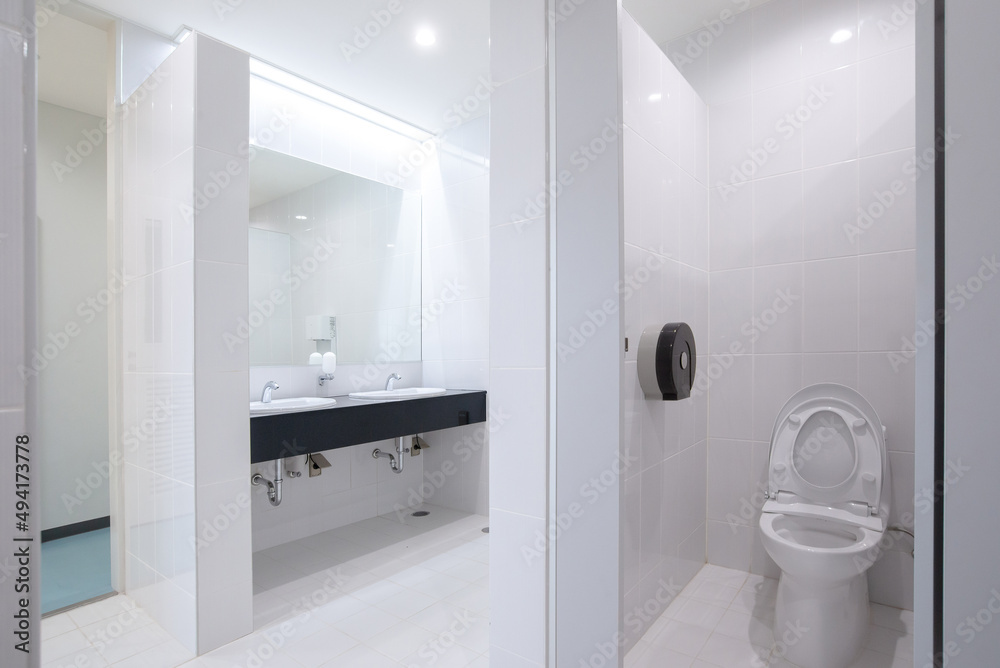 View of public toilet with basin and mirror View of public toilet with basin and mirror