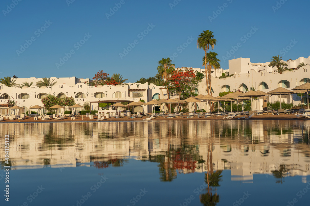 Calm beach on the red sea of Sharm El Sheikh during sunrise, Egypt