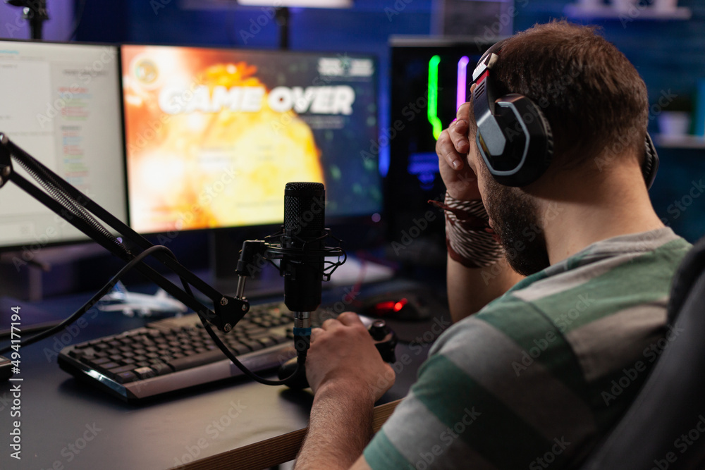 Person losing video games on live stream with chat. Man using headphones and microphone to broadcast gameplay, streaming lost game on computer. Gamer playing online on social media. Person losing video games on live stream with chat. Man using headphones and microphone to broadcast gameplay, streaming lost game on computer. Gamer playing online on social media.