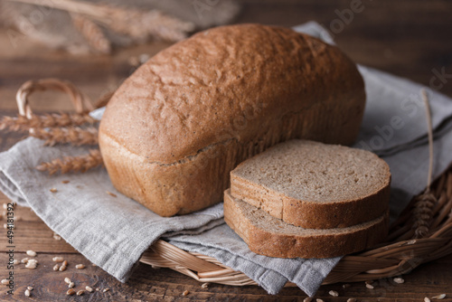 bread and wheat on wooden table