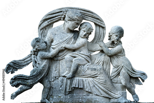 Very ancient stone statue of family in grief. Death of father and single mother with young children.