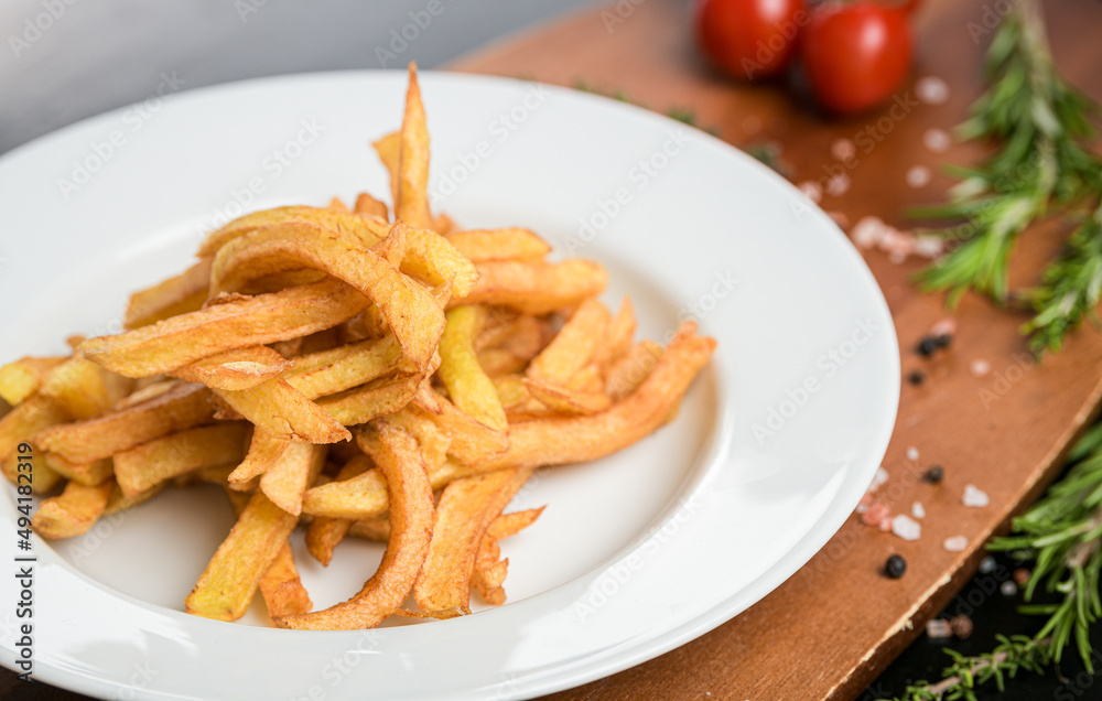 A dish with french fries ready to be served. One of the most popular snack side food in the world. Food photography.