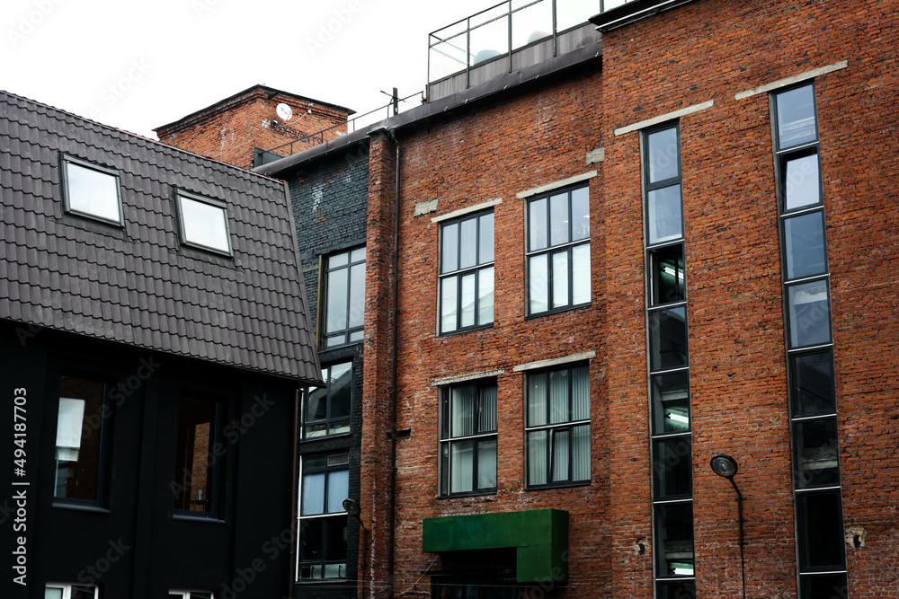 Obraz premium old loft brick houses in the city