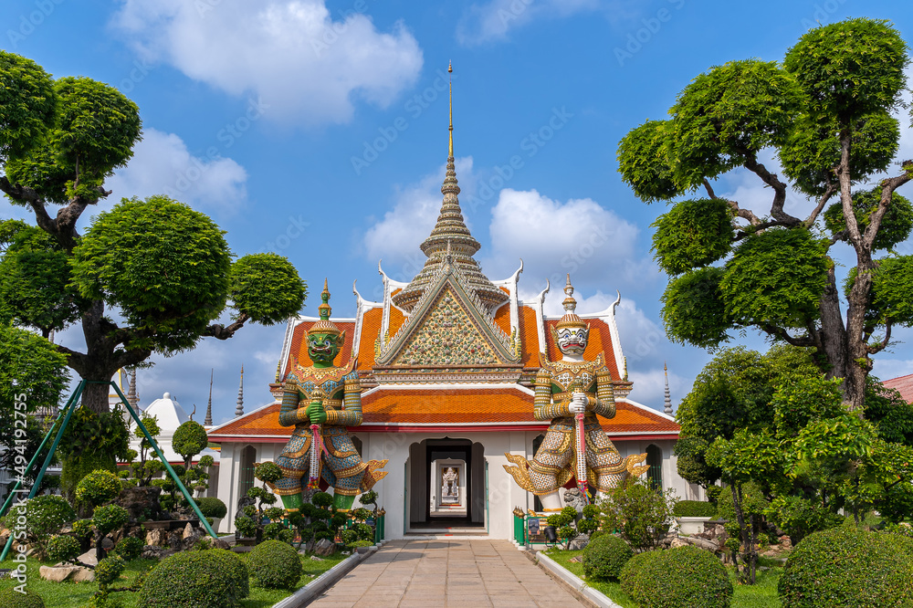 Giants front of the church at Wat Arun Temple. Wat Arun is among the best known of Thailand's landmarks. Wat Arun is a Buddhist temple in Bangkok Yai district of Bangkok, Thailand.