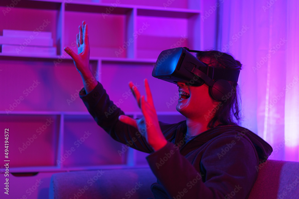 Metaverse technology concept, Man wear VR goggles and have fun to touch experience in virtual world Metaverse technology concept, Man wear VR goggles and have fun to touch experience in virtual world