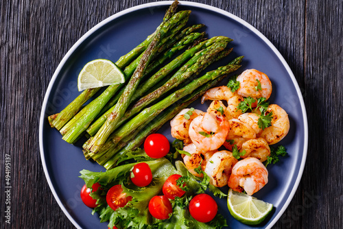toasty asparagus with fried prawns, lime and salad