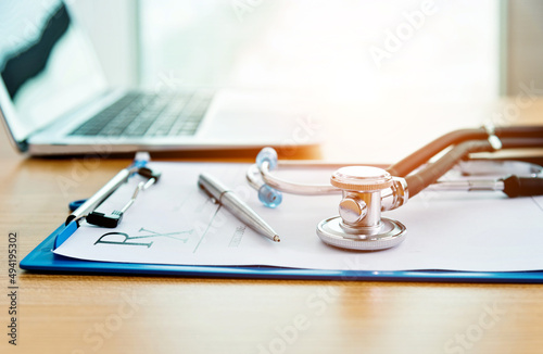 Konstfotografi Stethoscope with clipboard and laptop on docotr desk