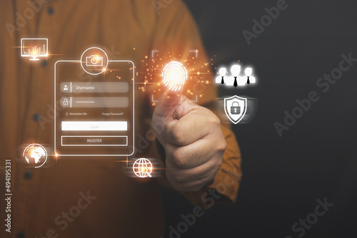 Concept of user and password of login, cyber security, keeping user personal data safe. Access to private information on the Internet online. Businessman uses a fingerprint scan of login.
