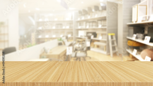 wood desk on blurry shop sells office tables and chairs background,mock up