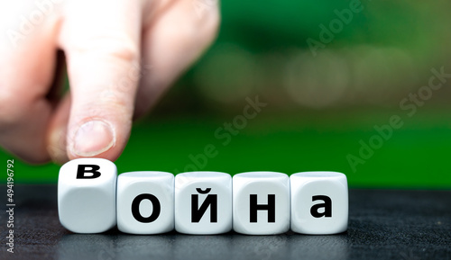 Dice form the Russian word for war in Cyrillic letters. Symbol to label the conflict in Ukraine as a war.