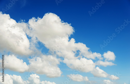 White fluffy clouds on blue sky