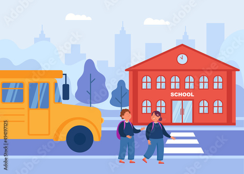 Bus next to cartoon children crossing road to school. Girl and boy walking outside, school entrance in background flat vector illustration. Education, transportation concept for banner, website design