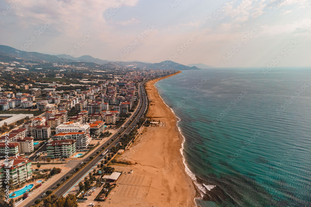 Drone photo of Alanya coast with Mediterranean turquoise sea and mountains, Turkey