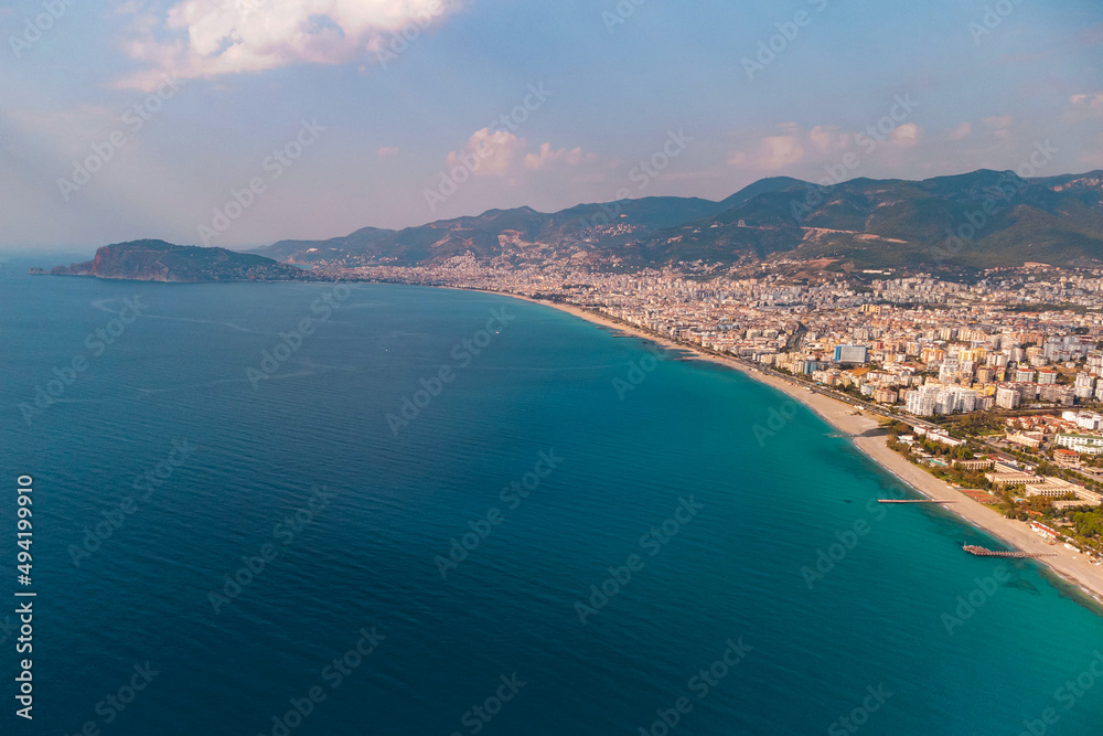 Obraz premium Drone photo of Alanya coast with Mediterranean turquoise sea and mountains, Turkey
