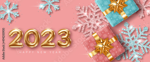 2023 New Year card template with 3d numbers, glittering decorative snowflakes and gift boxes © nonikastar