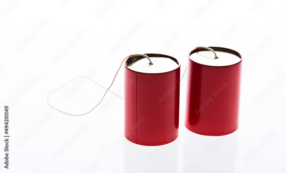 Red tin cans telephone isolated on white background Red tin cans telephone isolated on white background