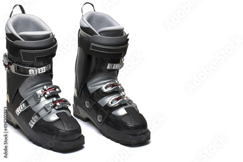 pair ski boots three buckles white background photo