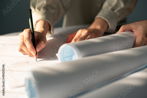Fotografija Architect designer Interior creative working hand drawing sketch plan blue print selection material color samples art tools Design Studio