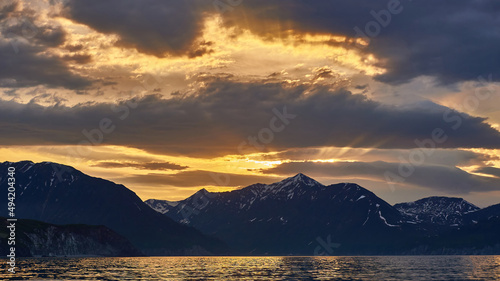 Sea sunset on the background of volcanoes and mountains. Kamchatka  Russia. Sea cruises and travel  