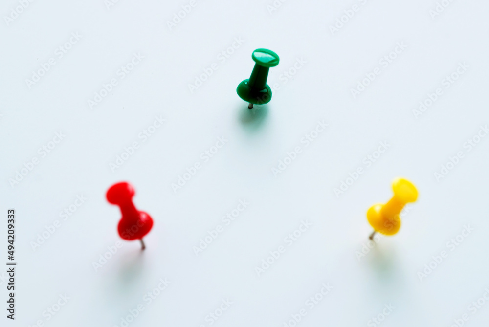 Three push pins isolated on white background Three push pins isolated on white background