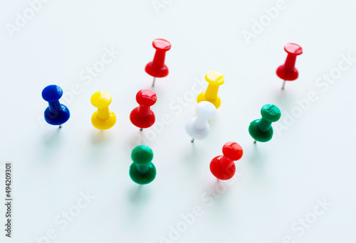 Group of push pins isolated on white