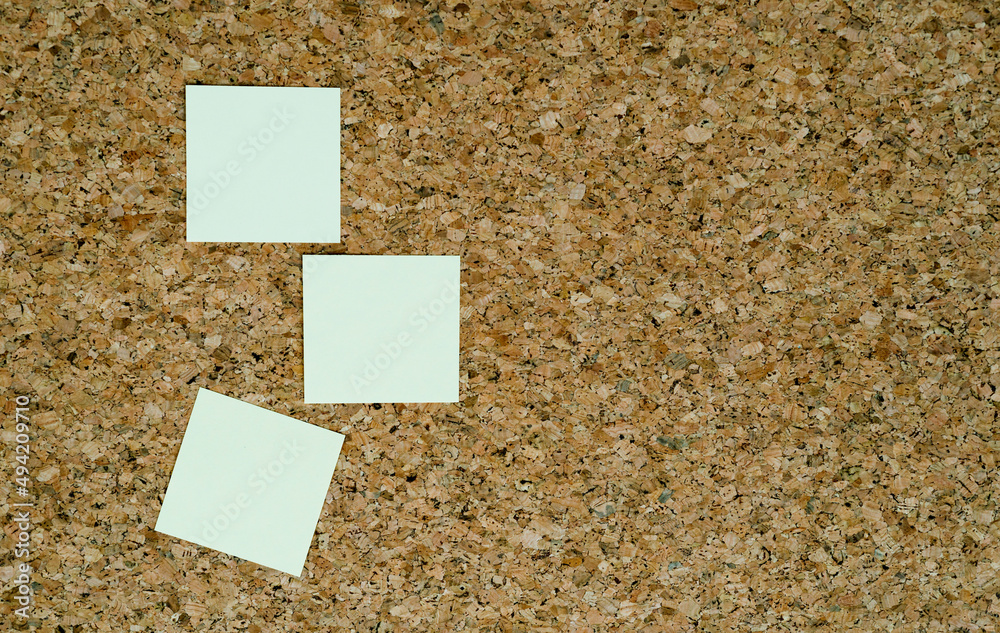 Three notes papers on cork board Three notes papers on cork board