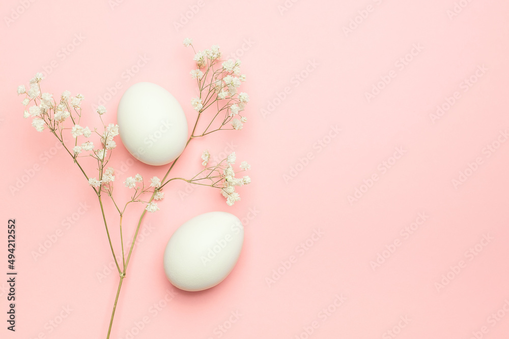Eggs with gypsophila on a pink background. Happy Easter concept. Minimal concept.