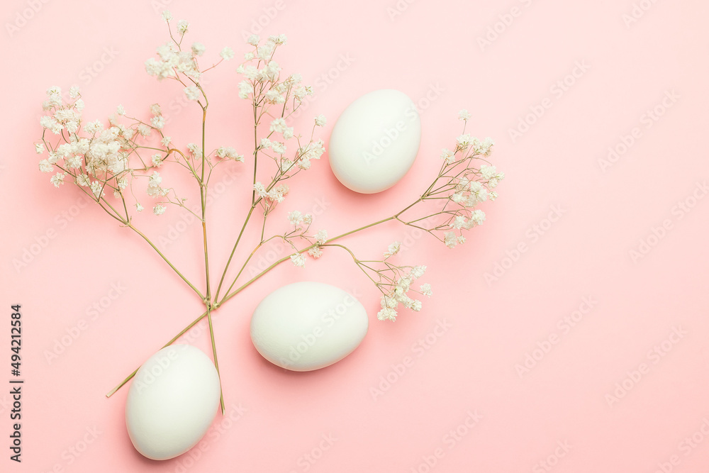 Eggs with gypsophila on a pink background. Happy Easter concept. Minimal concept. Eggs with gypsophila on a pink background. Happy Easter concept. Minimal concept.