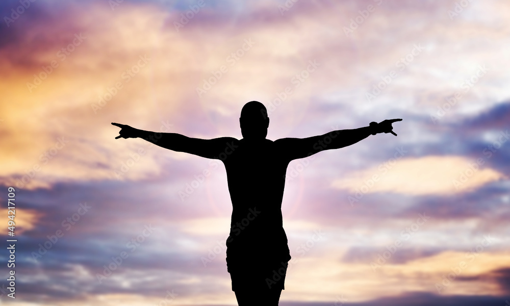 Zen meditation background. Sunset man silhouette. Human body isolated on colorful sky.