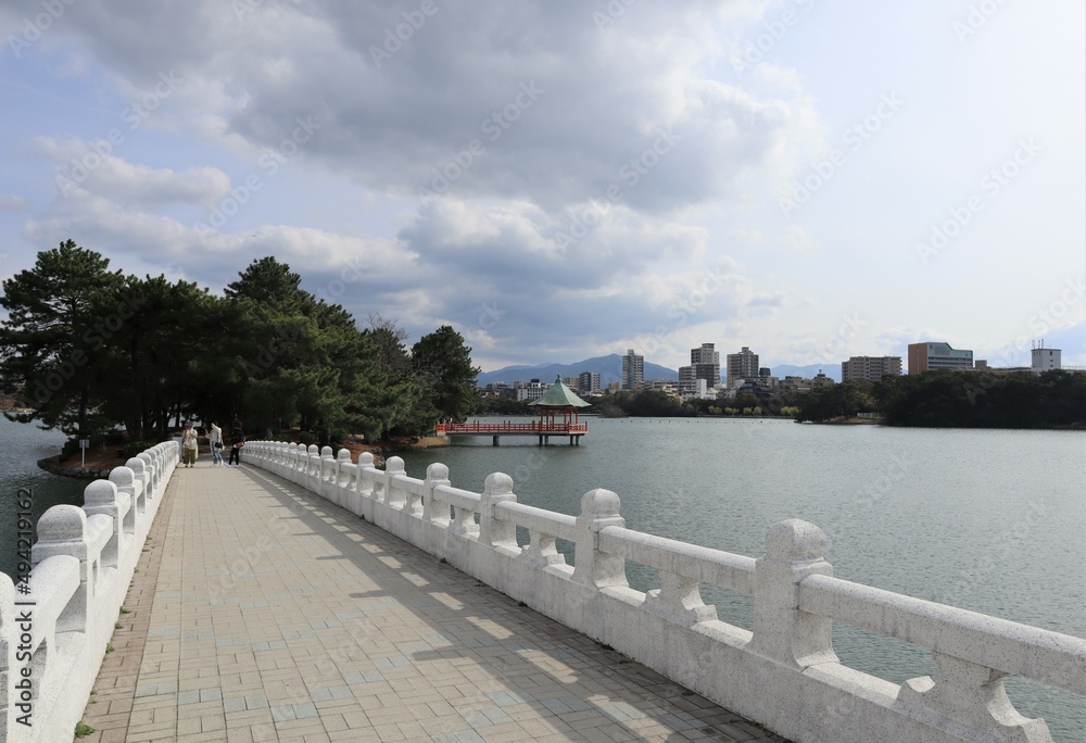 A long white bridge that is a symbol of Ohori Park