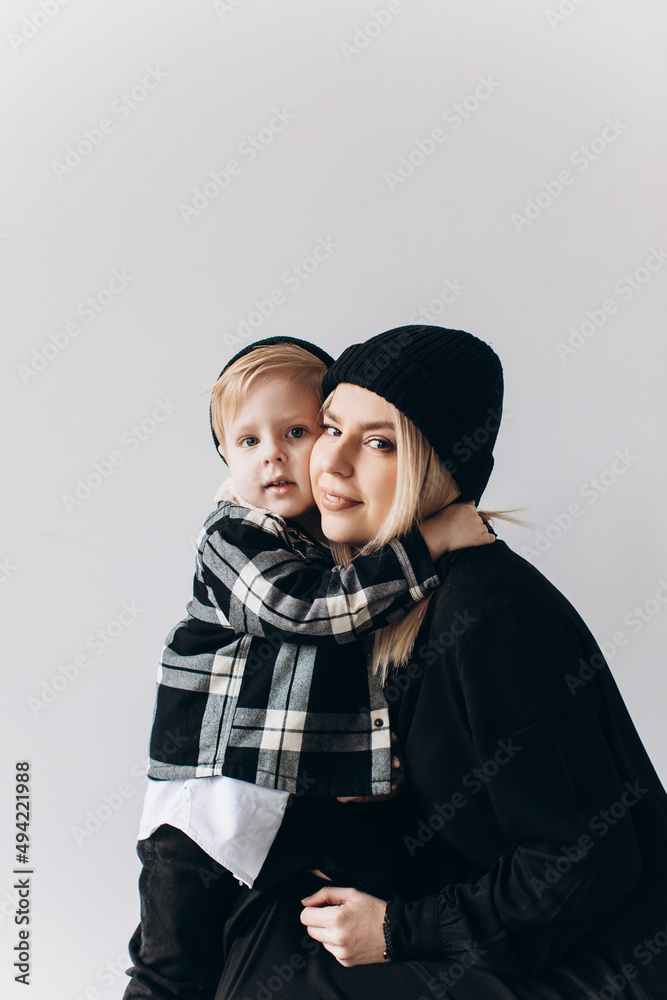portrait of affectionate mother and son isolated over white background. cute mother hugs her child