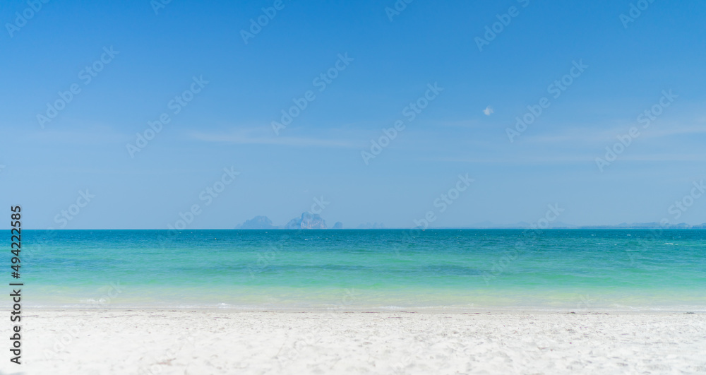 Clear beach with moutain background and beautiful blue sky
