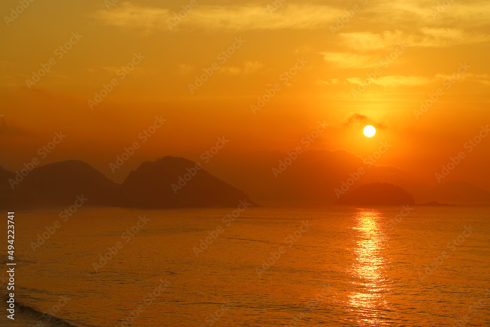 Stunning sunrise over the Atlantic ocean view from Copacabana beach, Rio de Janeiro, Brazil