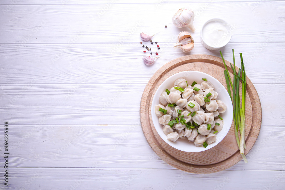 Ready-made dumplings on a white background with place for text