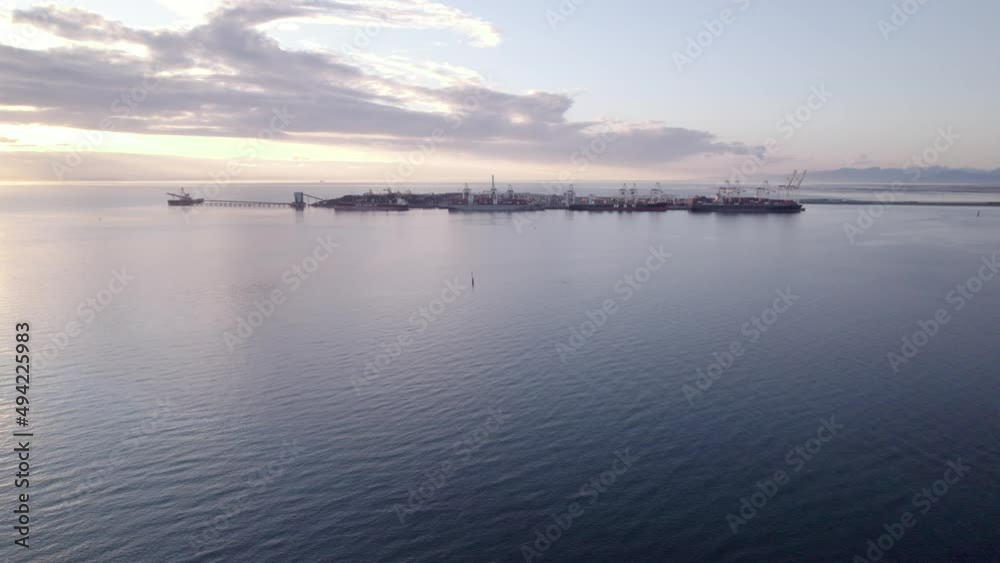 Aerial approach of Tsawwassen Vancouver ferry terminal at sunset, British Columbia in Canada Aerial approach of Tsawwassen Vancouver ferry terminal at sunset, British Columbia in Canada