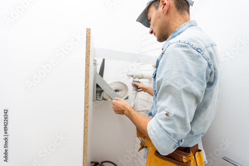 worker checks the fire hydrant