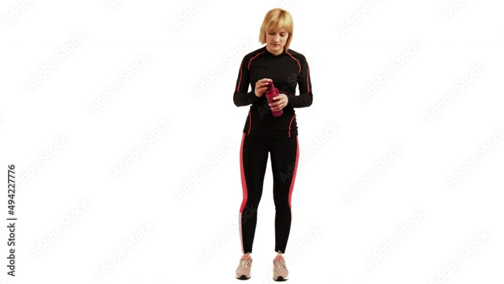 Hydrating post workout aerobics session on a white backdrop isolated Hydrating post workout aerobics session on a white backdrop isolated