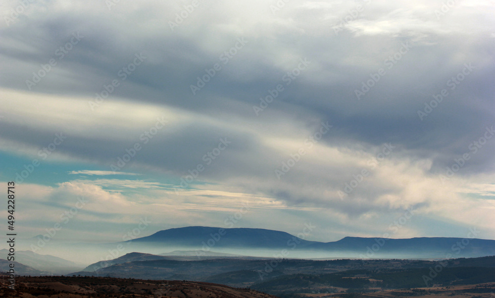 foggy mountain and clouds in the sky foggy mountain and clouds in the sky