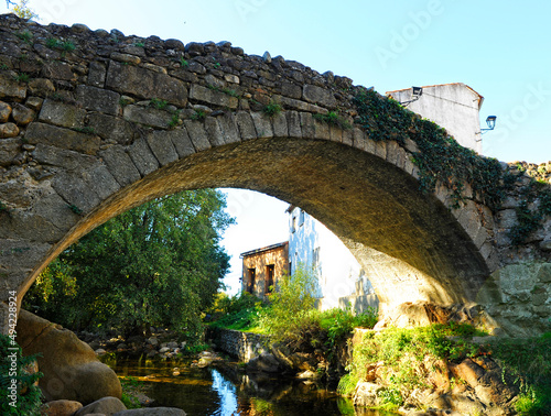 Medieval bridge over the Ambroz river in Hervas, province of Cáceres, Extremadura, Spain photo