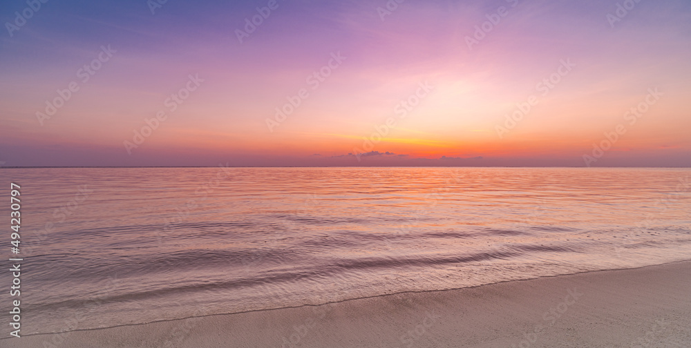 Closeup sea sand beach. Panoramic beach landscape. Inspire tropical beach seascape horizon. Purple gold sunset sky peaceful tranquil relaxing sunlight summer mood. Vacation coast travel holiday banner Closeup sea sand beach. Panoramic beach landscape. Inspire tropical beach seascape horizon. Purple gold sunset sky peaceful tranquil relaxing sunlight summer mood. Vacation coast travel holiday banner