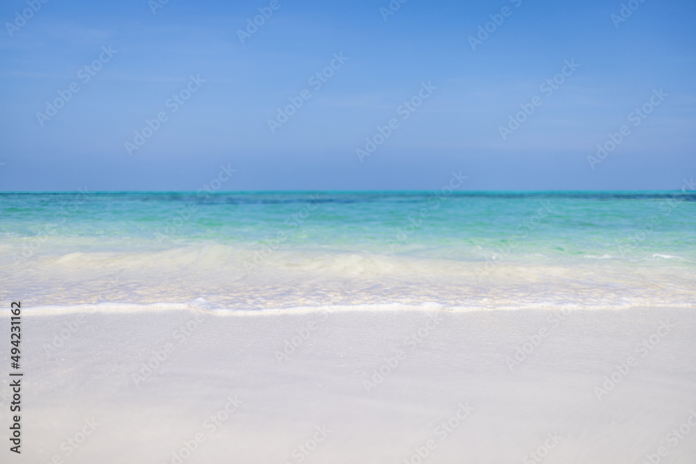 Sea sand sky on a summer day. Tranquil nature scene, closeup amazing blue sea with horizon and blue sky. Idyllic tropical island shore, coast landscape. Beautiful exotic beach, travel vacation concept