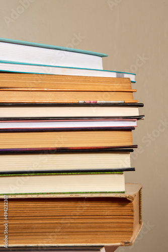 Close-up of background stack of old used books. Pile of vintage old books. Back to school