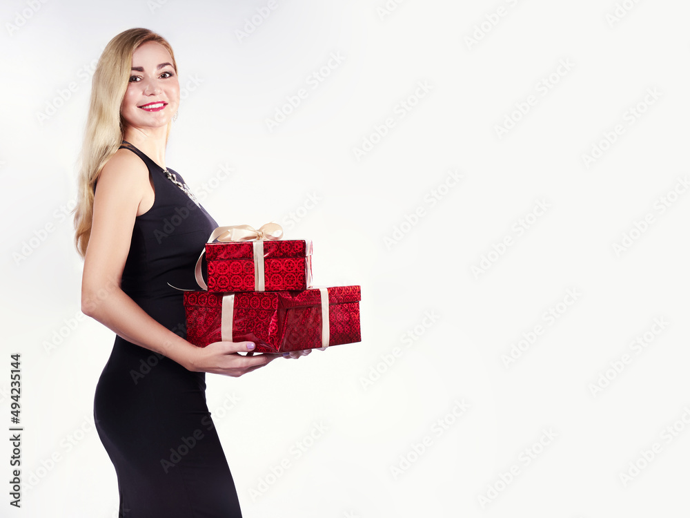 Young, beautiful girl with gift boxes in her hands. Young, beautiful girl with gift boxes in her hands.