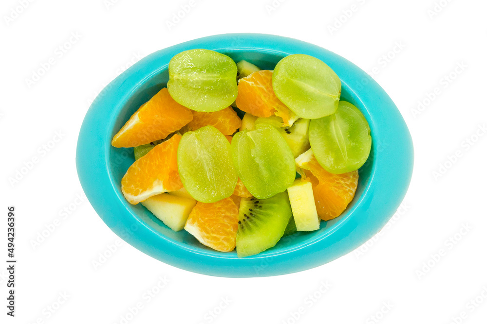 seedless grapes orange kiwi apples cut in pieces in blue oval shaped bowl or plate on isolated white background with clipping path seedless grapes orange kiwi apples cut in pieces in blue oval shaped bowl or plate on isolated white background with clipping path