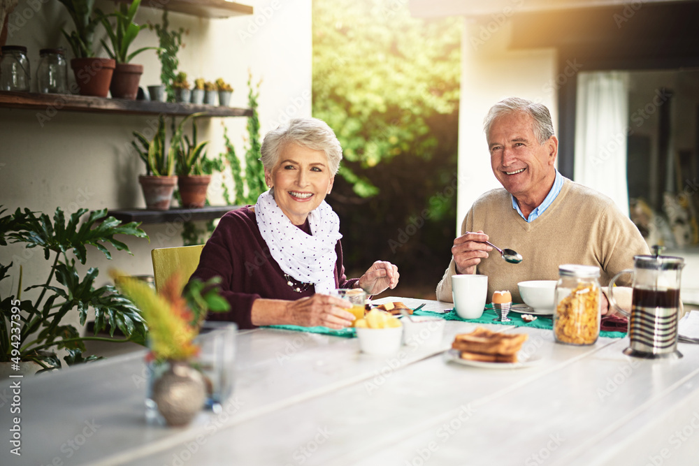 People who love breakfast are always the best people. Portrait of a happy senior couple enjoying breakfast together at home. People who love breakfast are always the best people. Portrait of a happy senior couple enjoying breakfast together at home.