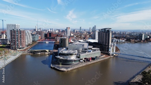 Drone image of Salford Quays with modern buildings and landmarks and views towards Manchester.  photo