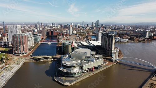 Cuadro en lienzo Drone image of Salford Quays with modern buildings and landmarks and views towards Manchester