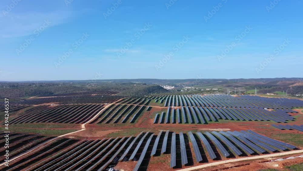 Aerial view of giant Portuguese fields with solar photovoltaic batteries to create clean ecological electricity. Southern Portugal of Europe.
