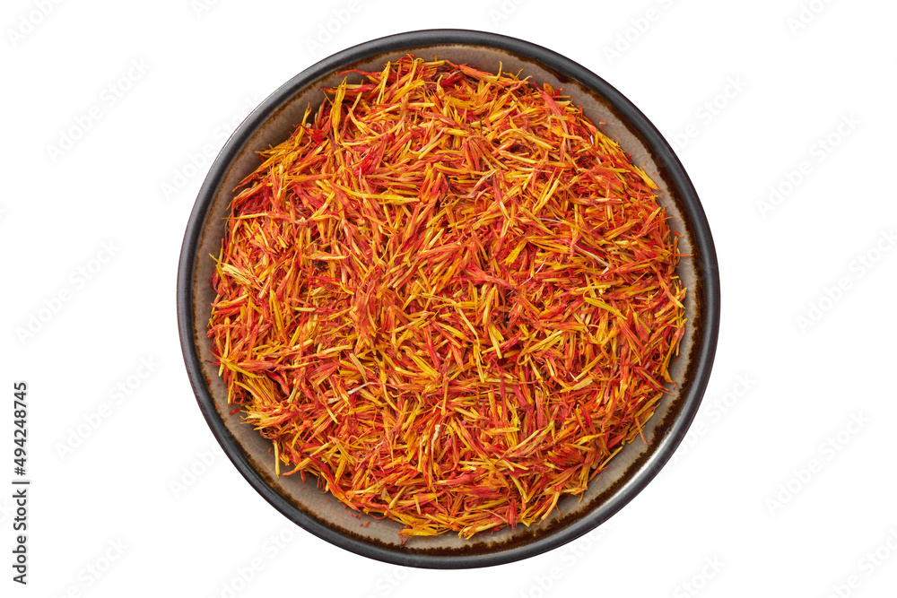 Bowl of Saffron seasoning closeup. Organic Saffron or alternative to saffron - Safflower spice in bowl, isolated on white. Top view. Bowl of Saffron seasoning closeup. Organic Saffron or alternative to saffron - Safflower spice in bowl, isolated on white. Top view.